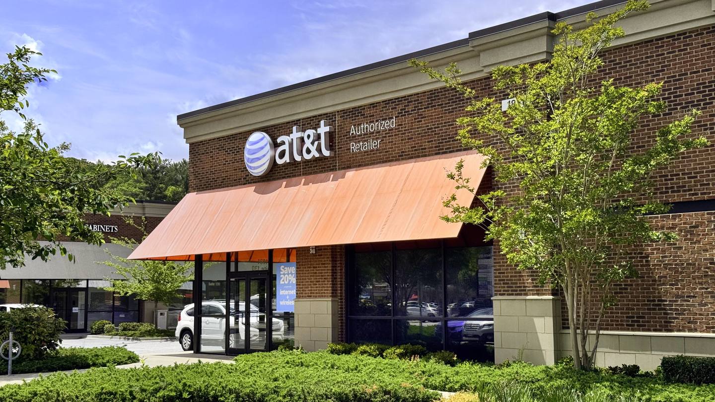 Exterior of an AT&T wireless retail store with an orange awning in Asheville, North Carolina