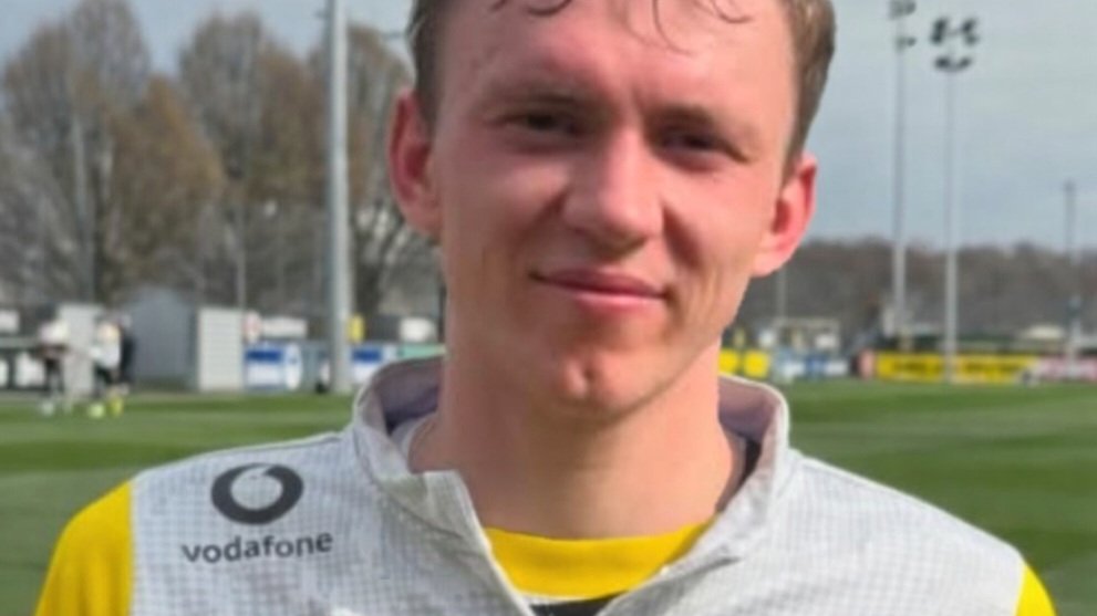 Borussia Dortmund forward Maximilian Beier in a black and yellow club training top on a training pitch