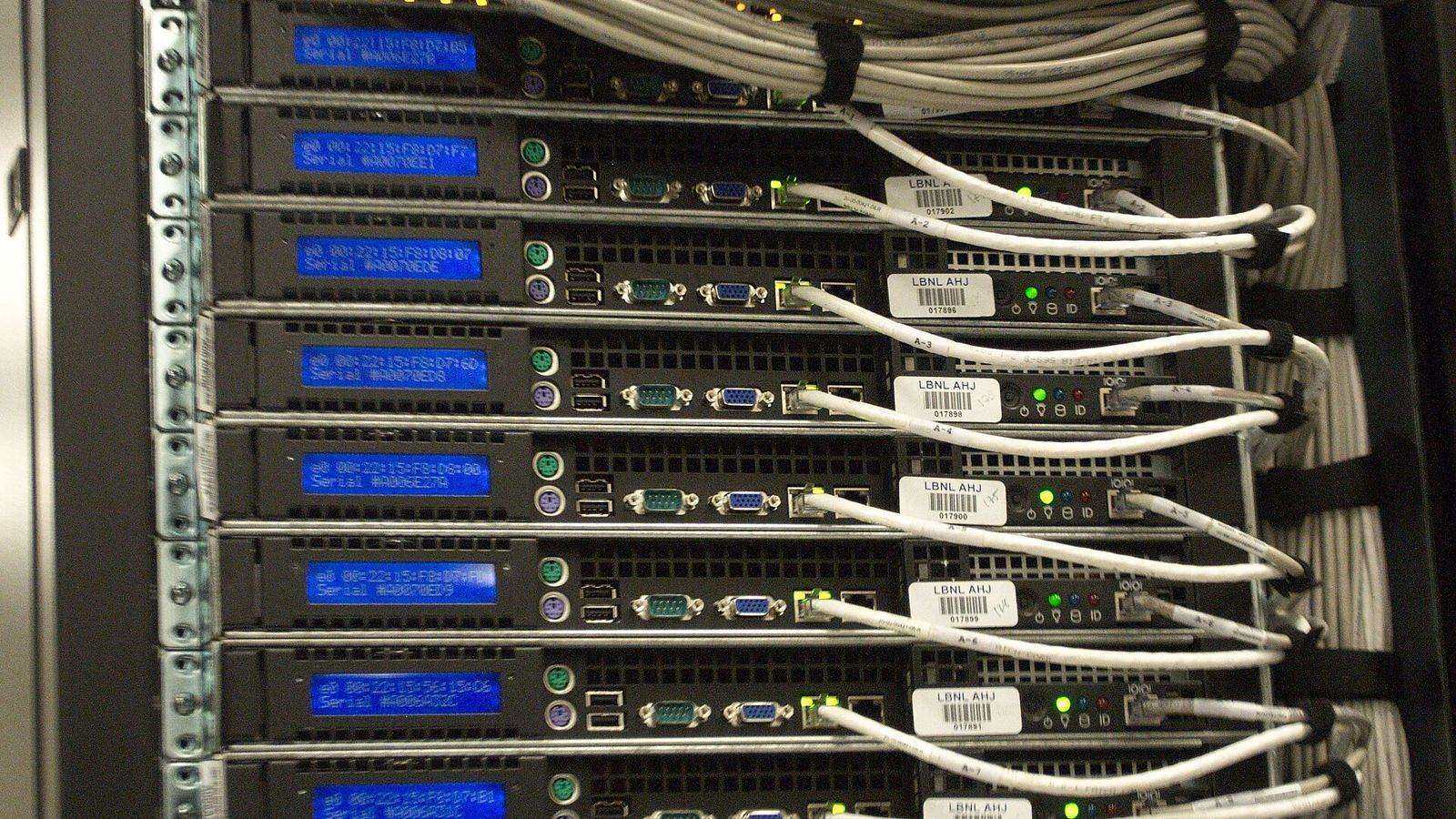 Close-up of cables and equipment at the rear of a server rack in a data centre