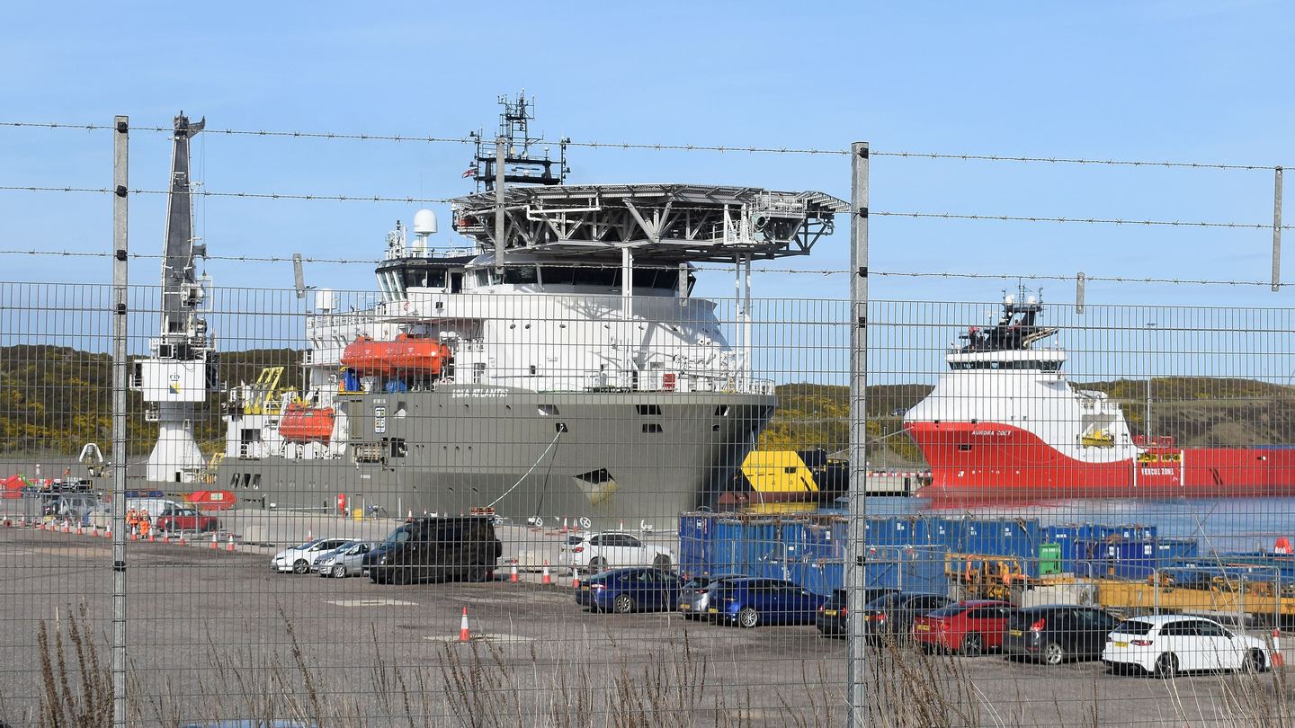 Several offshore supply vessels moored at a quay in Aberdeen South Harbour under a blue sky
