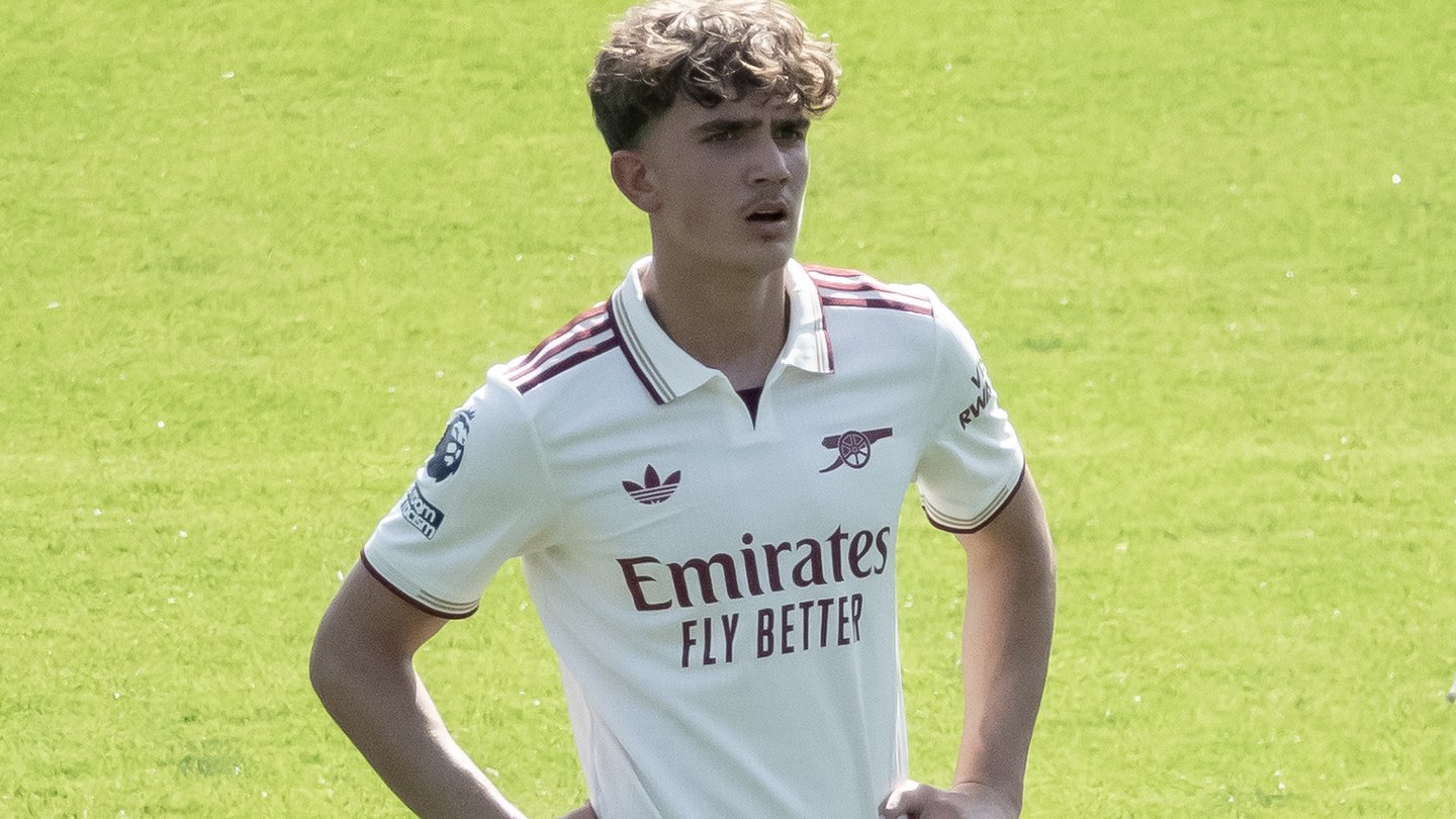 Arsenal midfielder Max Dowman in Arsenal's white away kit on the pitch