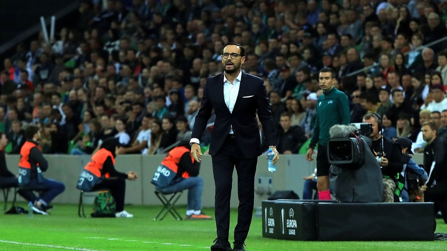 José Bordalás in a dark suit standing on the touchline in front of a crowd