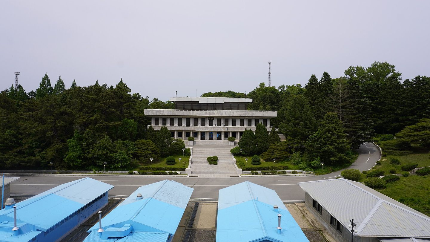 The blue conference huts of the Joint Security Area at Panmunjom on the inter-Korean border, with Panmungak hall on the North Korean side behind them