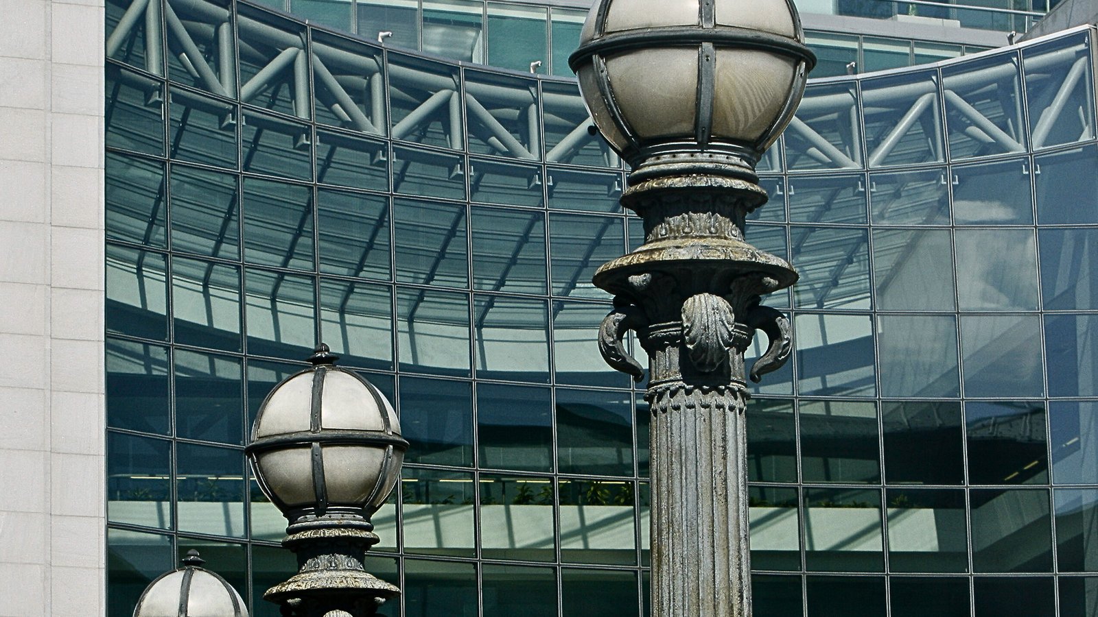 Ornate street lamps in front of the curved glass facade of the US Securities and Exchange Commission headquarters in Washington