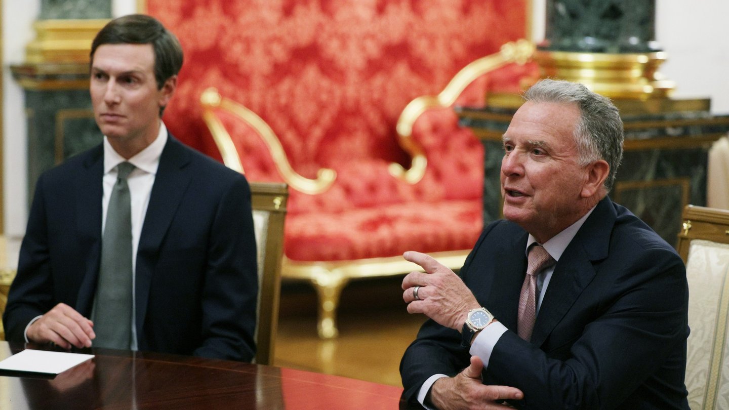US special envoy Steve Witkoff, in a dark suit, gestures while seated at a table in an ornate Kremlin hall, with Jared Kushner seated beside him
