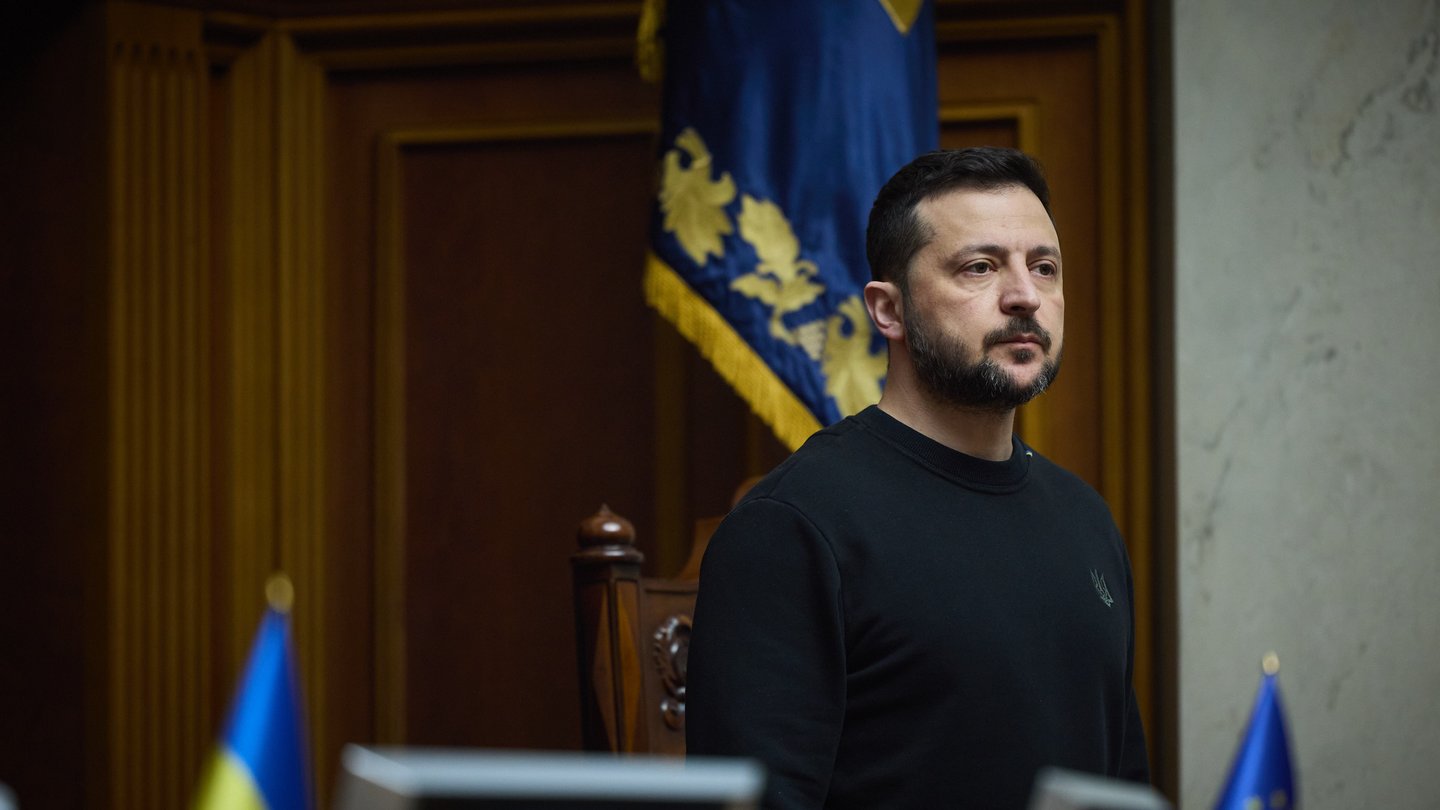 President Volodymyr Zelenskyy standing at the presidium of the Verkhovna Rada chamber in Kyiv