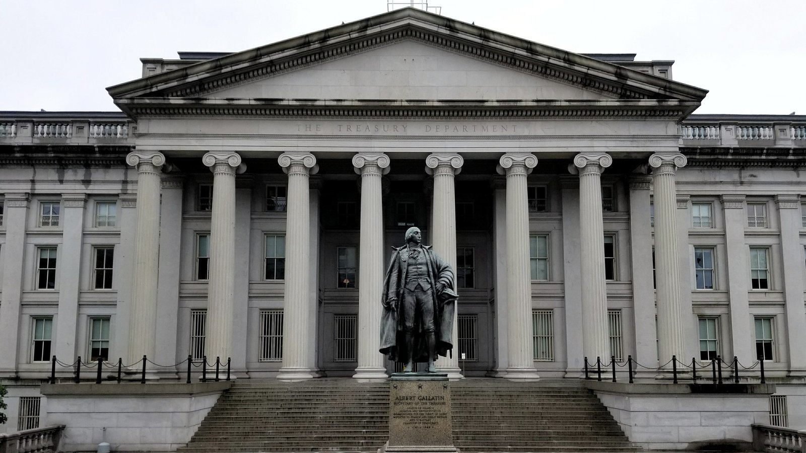The north entrance of the US Treasury Building in Washington, with the statue of Albert Gallatin in front