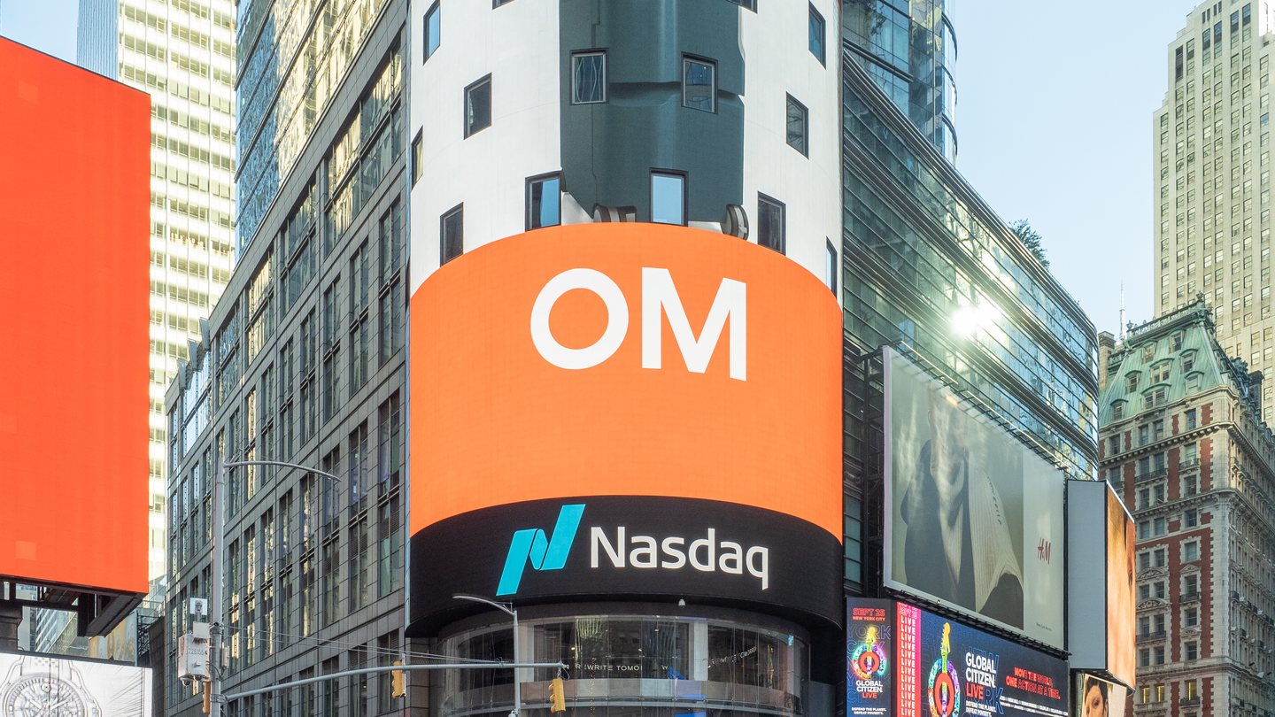 The Nasdaq MarketSite tower in Times Square, New York, with its curved video screen and the Nasdaq logo